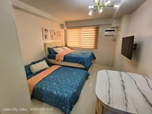 Postel nebo postele na pokoji v ubytování Happy Homes Fully Furnish Condo Unit - Persimmon + 21 fotografií