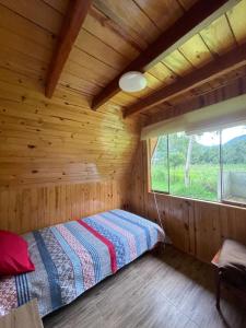 Postel nebo postele na pokoji v ubytování Cabaña Alpina Yanesh Haus + 4 fotografie