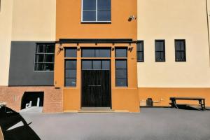 a building with a door in front of it at Penzion Navara in Kolín