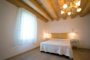 Krevet ili kreveti u jedinici u okviru objekta Agriturismo Ae Cavane
