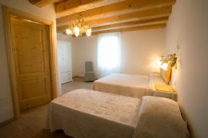 Krevet ili kreveti u jedinici u okviru objekta Agriturismo Ae Cavane
