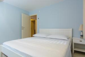 Postel nebo postele na pokoji v ubytování Luxury Apartment Kalebic