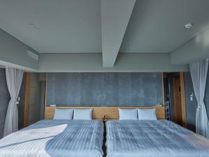 Postel nebo postele na pokoji v ubytování ANDO HOTEL NARA Wakakusayama -DLIGHT LIFE & HOTELS-