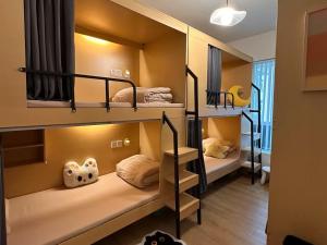 Voodi või voodid majutusasutuse Nomadic International Hostel Shenzhen North Railway Stn Store toas
