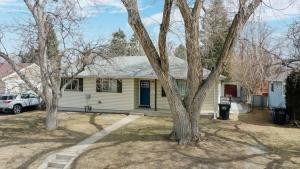 a house with a car parked in a yard at Peaceful retreat in quite neighborhood in Denver
