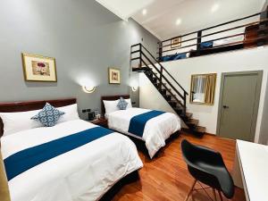 Postel nebo postele na pokoji v ubytování ACCEL Hotel Casa Nueva