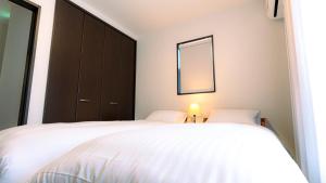 Postel nebo postele na pokoji v ubytování Homey Inn