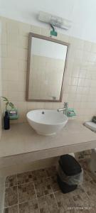 Um banheiro em Hotel Coral