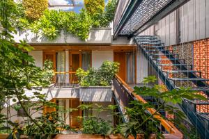 an external view of a building with plants at Lahome Boutique Villa and Apartment in Da Nang +62 photos