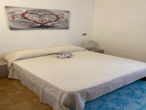A bed or beds in a room at Apartment in Porto Pollo near Surf Paradise