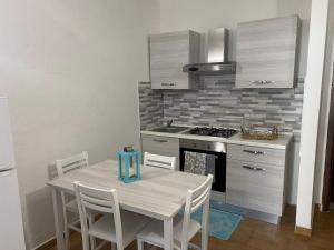 A kitchen or kitchenette at Apartment in Porto Pollo near Surf Paradise