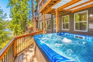 a hot tub on the balcony of a house at White Water Lodge in Leavenworth