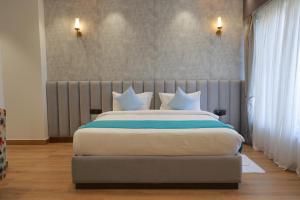Postel nebo postele na pokoji v ubytování Kaara Gurgaon + 10 fotografií
