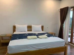 Postel nebo postele na pokoji v ubytování Tommy Homestay
