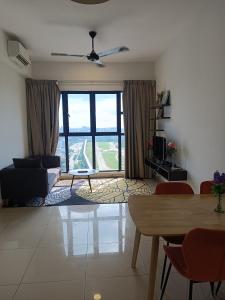 a living room with a couch and a table at Trion Residence Kuala Lumpur by Infinity in Kuala Lumpur