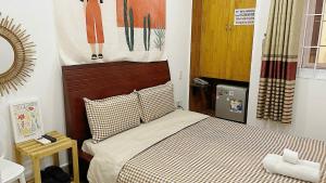 Postel nebo postele na pokoji v ubytování Hệ thống MylaHome - Chi nhánh Ks Kim Châu