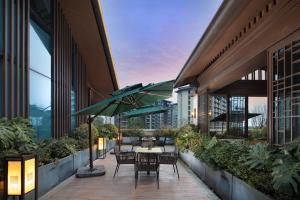 Balkón nebo terasa v ubytování 峨眉山景区希尔顿欢朋酒店