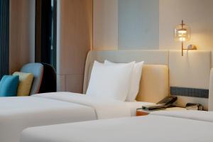Letto o letti in una camera di Pullman Renhuai Chuangmeng
