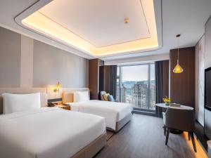 Letto o letti in una camera di Pullman Renhuai Chuangmeng