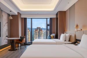 Letto o letti in una camera di Pullman Renhuai Chuangmeng