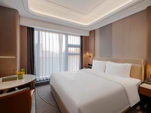 Letto o letti in una camera di Pullman Renhuai Chuangmeng