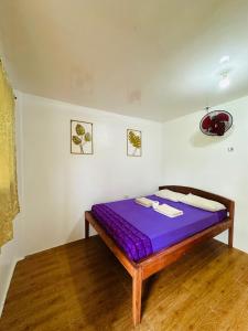 Postel nebo postele na pokoji v ubytování Cris & Mar Homestay