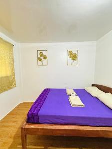 Postel nebo postele na pokoji v ubytování Cris & Mar Homestay