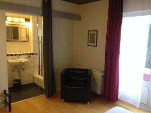 Koupelna v ubytování Hotel Saarland Lebach + 37 fotografií
