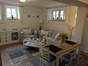 a living room with a table and a couch at Apartment Schreyegg in Seefeld