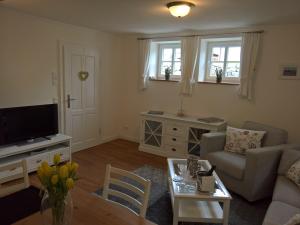 a living room with a couch and a table at Apartment Schreyegg in Seefeld