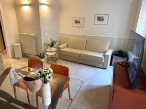 a living room with a couch and a table at Germano Reale in Iseo