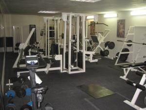 a gym with lots of equipment in a room at Sporthostel Scandinavia in Prague