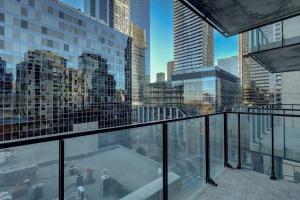 a view of a city skyline from a balcony at comfy studio in Old Port Montreal in Montréal