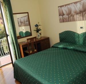 Postel nebo postele na pokoji v ubytování Hotel Miranda