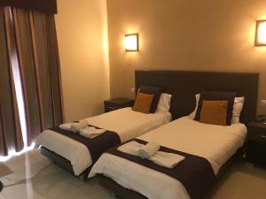 The Windsor Hotel客房内的一张或多张床位
