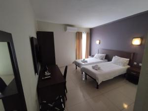 The Windsor Hotel客房内的一张或多张床位
