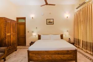 Ένα ή περισσότερα κρεβάτια σε δωμάτιο στο Club Mahindra Bharatpur