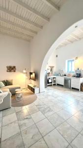 a large living room with a large stone floor at ''TSI TSI' traditional home & private Pool' in Kalithies