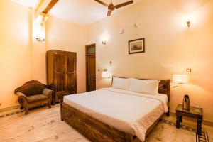 Ένα ή περισσότερα κρεβάτια σε δωμάτιο στο Club Mahindra Bharatpur