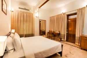 Ένα ή περισσότερα κρεβάτια σε δωμάτιο στο Club Mahindra Bharatpur +28 φωτογραφίες
