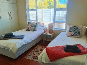 Cama o camas de una habitación en Frangipani House 33 fotos más