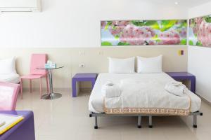 Postel nebo postele na pokoji v ubytování Hotel Christina Plus