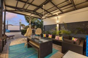 an outdoor patio with a couch and a table at The Jetty in Lancelin