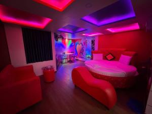 a bedroom with a bed with pink lights on it at Khách Sạn Lộc Thọ in Ho Chi Minh City +25 photos