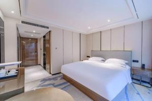 Letto o letti in una camera di Bingo-威尔顿酒店-昆明火车站云纺商业城店