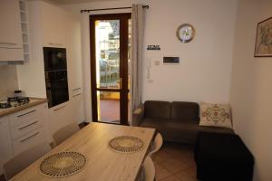 a small living room with a table and a couch at La Casina di Kappe in Borgo a Buggiano