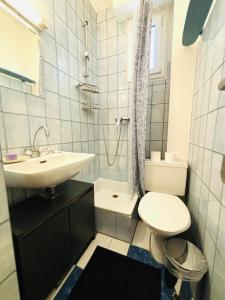 Koupelna v ubytování Appartement Tour Eiffel Chapu + 13 fotografií