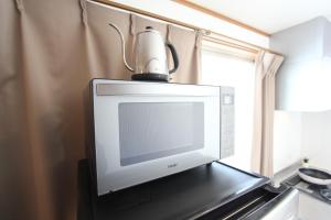 Kuchyň nebo kuchyňský kout v ubytování HOTEL LUANA in NISHIKI