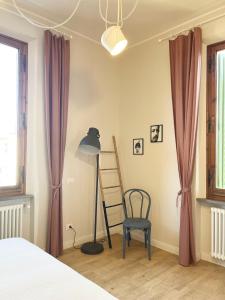 Ένα ή περισσότερα κρεβάτια σε δωμάτιο στο LE COLLINE HOUSE San Miniato