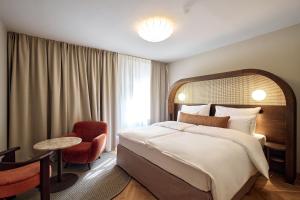 Postel nebo postele na pokoji v ubytování Hotel Palais Mailberger Hof